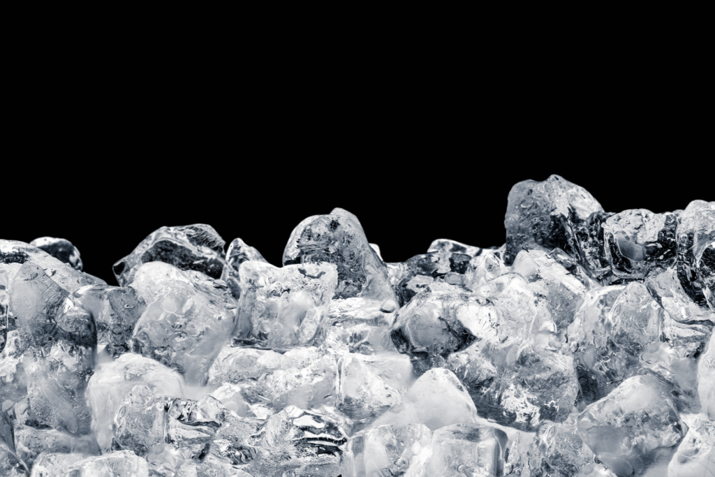 Pieces of crushed ice cubes on black background.